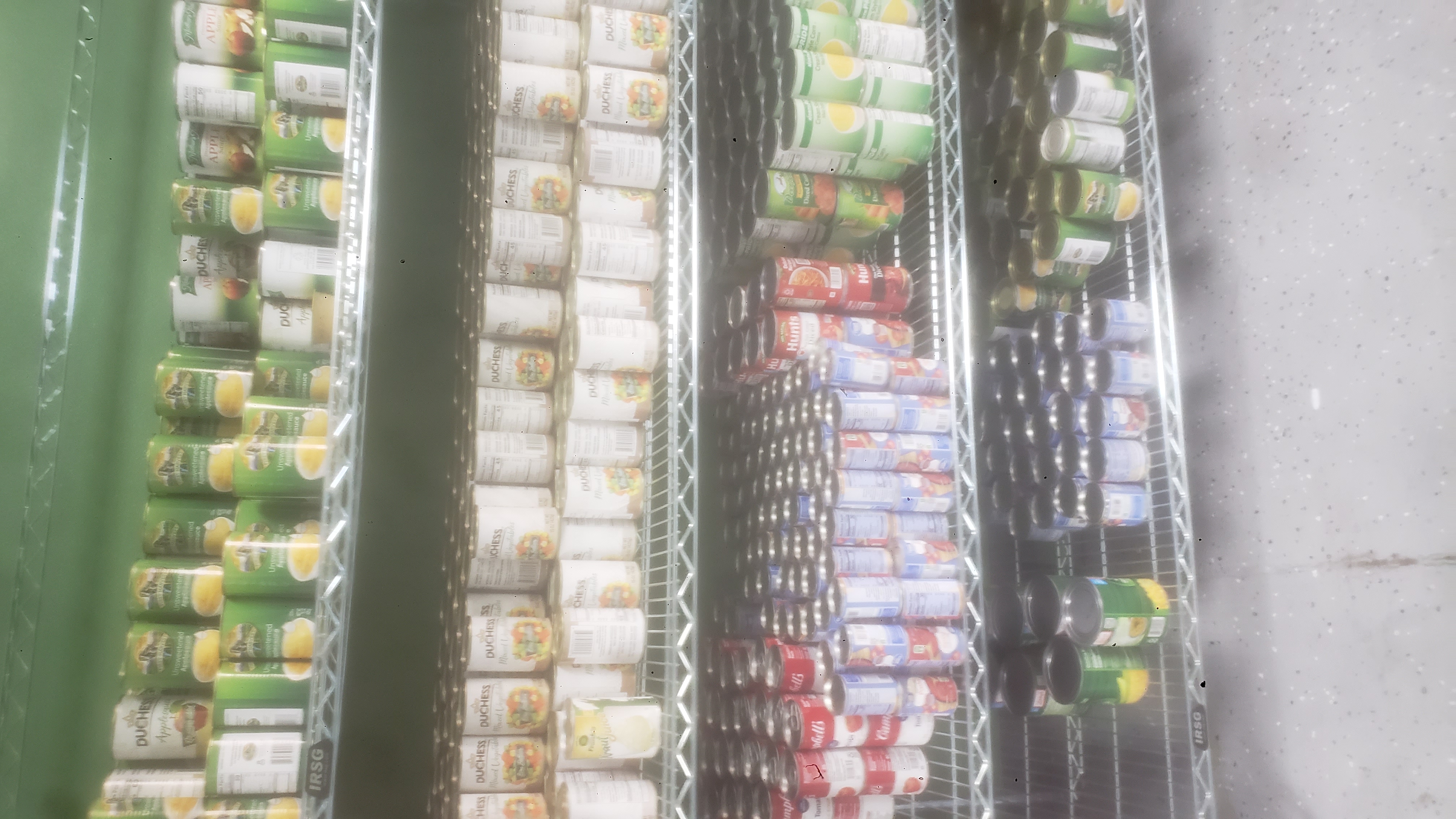 Shelves packed with canned foods.